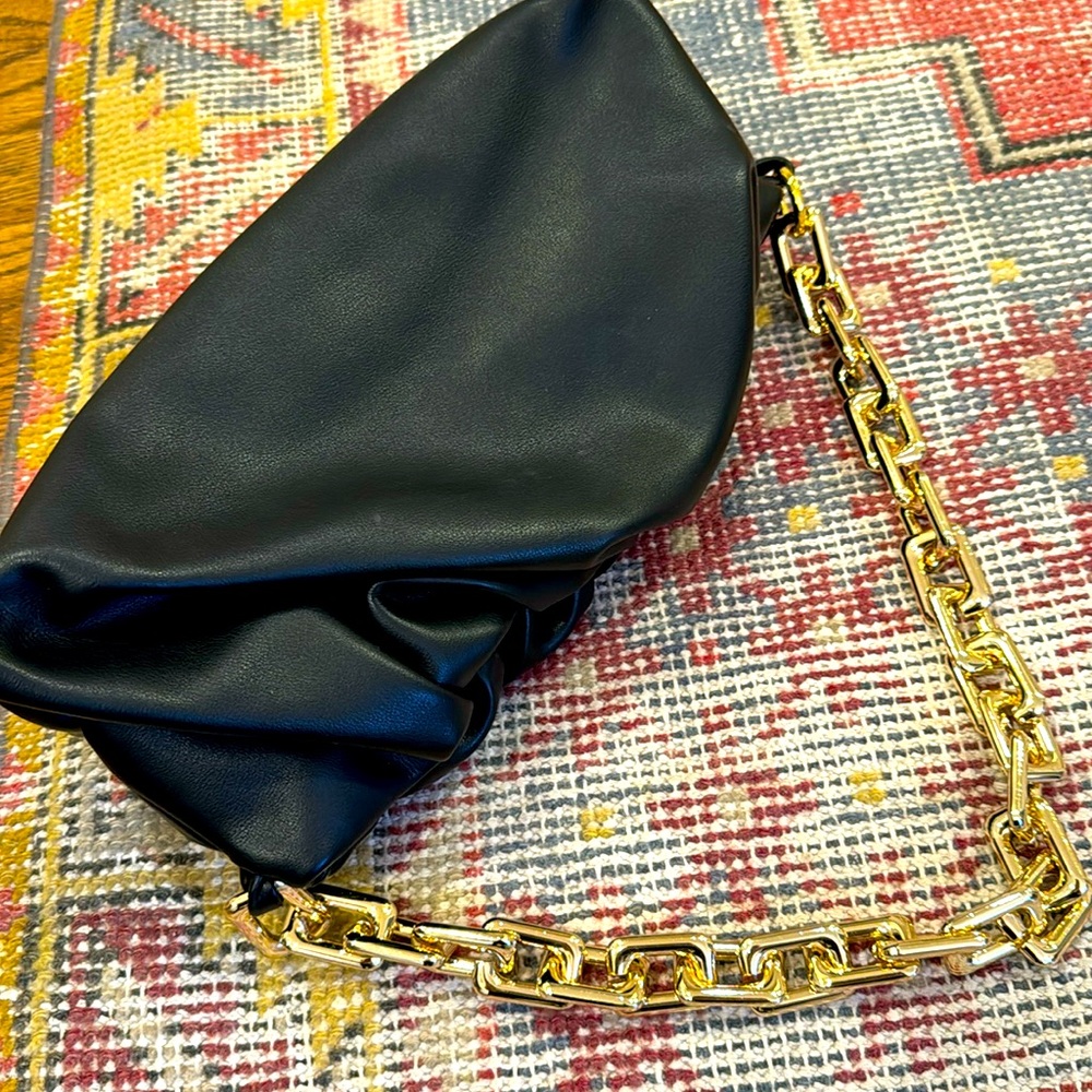Black purse with gold chain